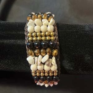 Brown, gold, black and cream soft Elegance Inc cuff bracelet